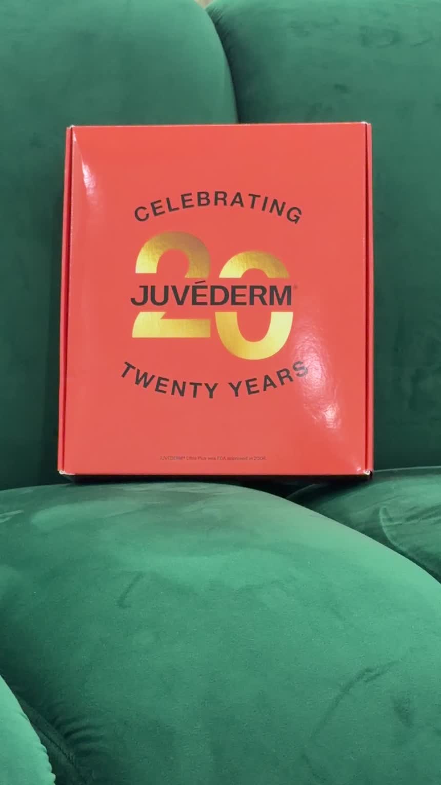 Limited-edition red and gold collector's box celebrating 20 years of Juvéderm hyaluronic acid dermal fillers